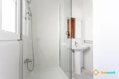 a bathroom with a shower and a sink at Torre Argantonio by LiveWork in Cádiz