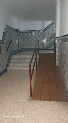 a staircase in a building with a stair case at Mi pisito La Maña in San Fernando