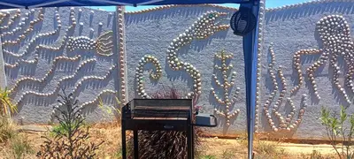 a mural of a cactus on a wall at Vacaciones en Novo Sancti Petri in Chiclana de la Frontera