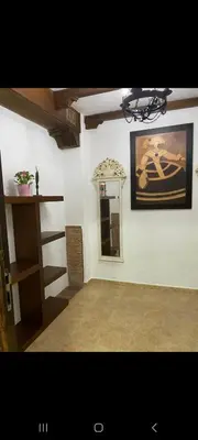 a living room with a couch and a table at Apartamento Donna Elvira in Caserío Bogás