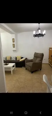 a room with a mirror and a painting on a wall at Apartamento Donna Elvira in Caserío Bogás