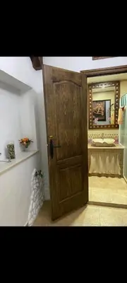 a white door with a sign on top of it at Apartamento Donna Elvira in Caserío Bogás