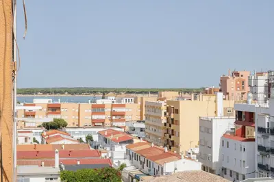 a view of a city with buildings at SibsSanlucar Azahar Centrico Vistas Terraza Coqueto in Sanlúcar de Barrameda