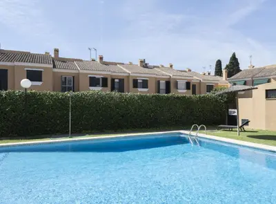 a large swimming pool in front of a house at Chalet Pareado & Piscina in El Puerto de Santa María