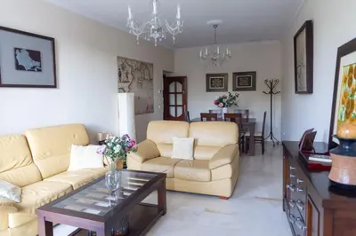 a living room with two couches and a table at Alameda by Gades Gestión in Cádiz