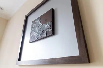 a picture in a frame hanging on a wall at Alameda by Gades Gestión in Cádiz