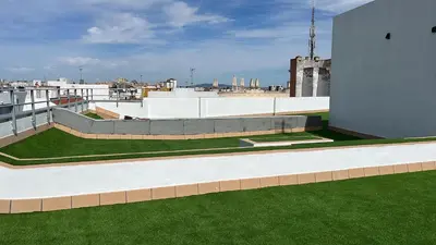 a view of a building with grass on the roof at ÁTICO Edificio RIANAL in Jerez de la Frontera