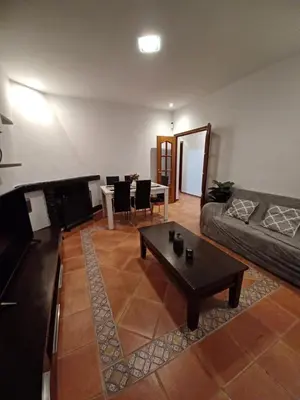 a living room with a couch and a table at Villa TRANQUILA in Chiclana de la Frontera