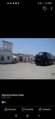 a black truck parked in front of a building at Hotel Arcos-Coruña in Arcos de la Frontera