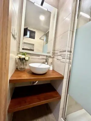 a bathroom with a sink and a mirror at GATU Castillo , 