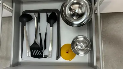 a cupboard with utensils in a kitchen at Lacana in Chiclana de la Frontera