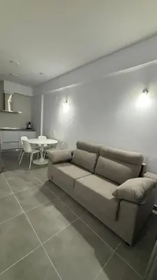 a living room with a couch and a table at Lacana in Chiclana de la Frontera