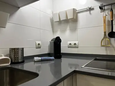 a kitchen with a counter top with a sink at Penthouse San Felix Grupo AC Gestion in Cádiz