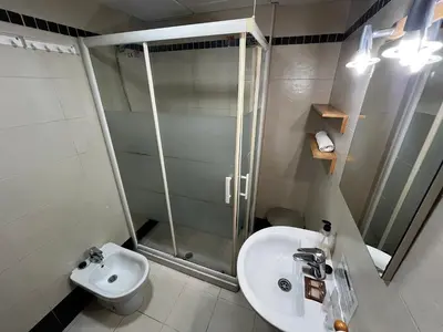 a bathroom with a shower and a sink and a toilet at Penthouse San Felix Grupo AC Gestion in Cádiz