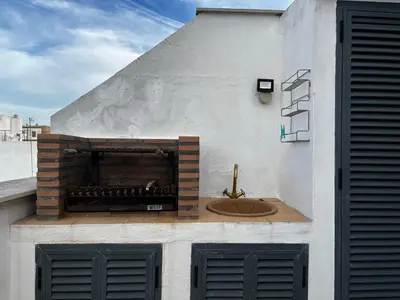 a building with a sink on the side of it at Penthouse San Felix Grupo AC Gestion in Cádiz