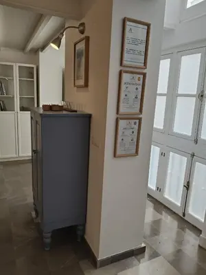 a room with a wall with signs on it at Robles-Mercado in Cádiz