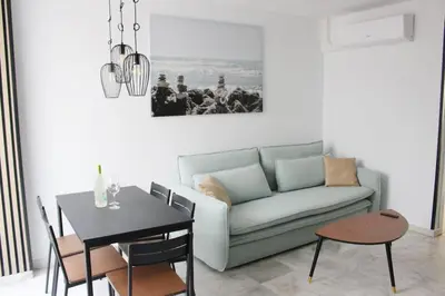 a living room with a couch and a table at Coqueto encantador en el centro in El Puerto de Santa María
