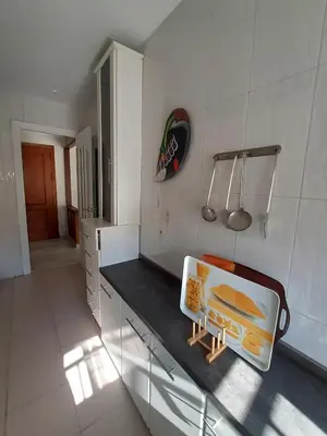 a kitchen with a counter top with a sink at El Parque 4 dormitorios wifi playa centro in Sanlúcar de Barrameda