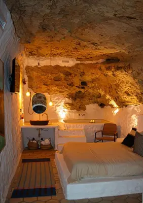 a bedroom with a bed in a cave at Laan Arcos, casa cueva in Arcos de la Frontera