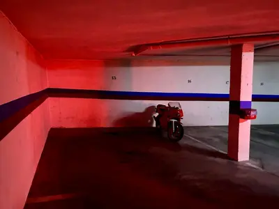 a motorcycle parked inside of a parking garage at GATU Faro con Parking gratis, 