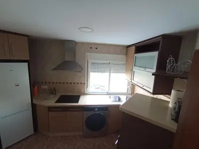 a small kitchen with a sink and a stove at Doña Cora in San Fernando