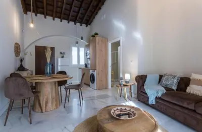 a living room with a couch and a table at Alcazar Centrico Moderno in Jerez de la Frontera