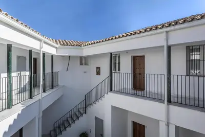 a view of the balconies of a white building at Alcazar Centrico Moderno in Jerez de la Frontera