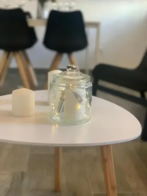 a glass jar on a table with lights on it at Apartamento Viñedos de Librado in Jerez de la Frontera