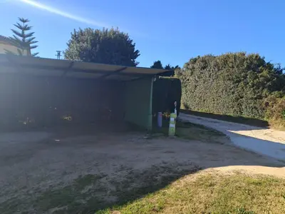 a garage that is sitting next to a driveway at Casa La Laguneta in Arcos de la Frontera