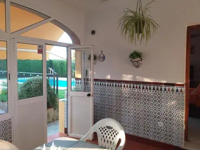 a room with a door and a tile wall at Casa La Laguneta in Arcos de la Frontera