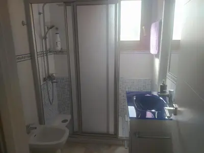 a bathroom with a sink and a toilet at Áprtamento novo Santi Petri in Chiclana de la Frontera