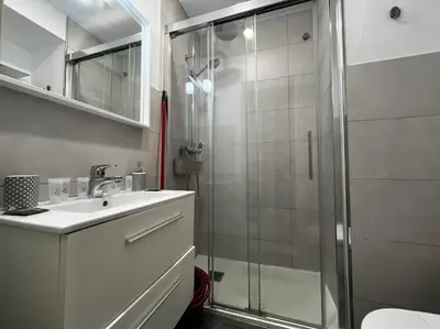 a bathroom with a shower and a sink and a toilet at Loft El Capricho Grupo Ac Gestion in Cádiz