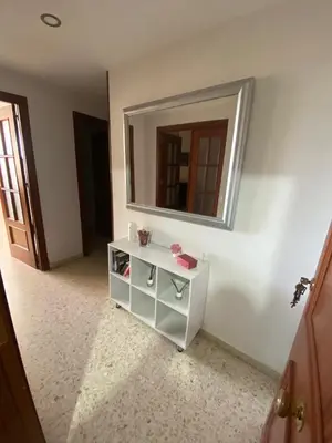a bathroom with a white cabinet and a mirror at Apartamento en Jerez de la Frontera in Jerez de la Frontera