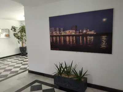a flat screen tv hanging on a wall at Piso Con Hermosas Vistas Al Mar in El Puerto de Santa María