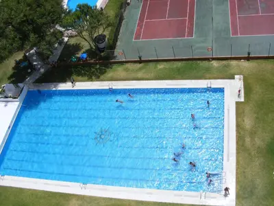 an overhead view of a large swimming pool at Piso Con Hermosas Vistas Al Mar in El Puerto de Santa María