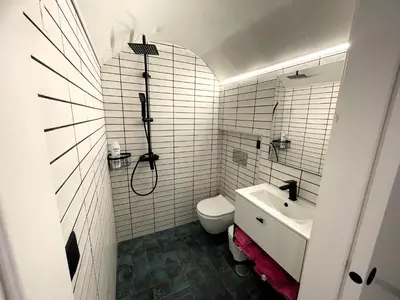a bathroom with a toilet and a sink at Apartamento Plaza del Cabildo II - Sanlúcar Centro in Sanlúcar de Barrameda