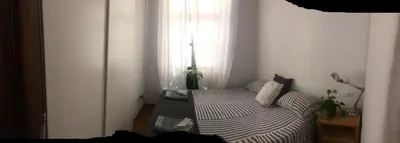 a living room with a couch and a window at Apartamento San Bartolomé in El Puerto de Santa María