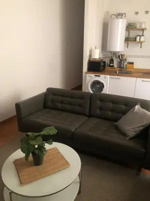 a living room with a couch and a table at Apartamento San Bartolomé in El Puerto de Santa María
