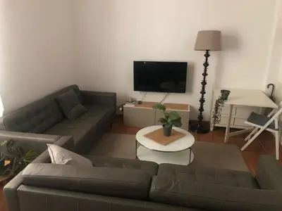 a living room with a couch and a table at Apartamento San Bartolomé in El Puerto de Santa María