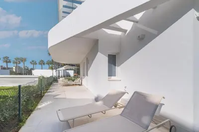 a patio with two chairs and a staircase at Oasis playa costa Ballena in Costa Ballena