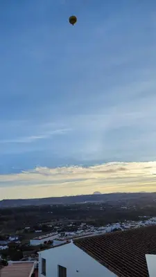 a frisbee flying in the air over a city at El mirador de Beatriz in Arcos de la Frontera