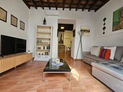a living room with a couch and a table at Sherryflat Naranjas 9 in Jerez de la Frontera