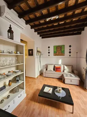 a living room with a couch and a table at Sherryflat Naranjas 9 in Jerez de la Frontera