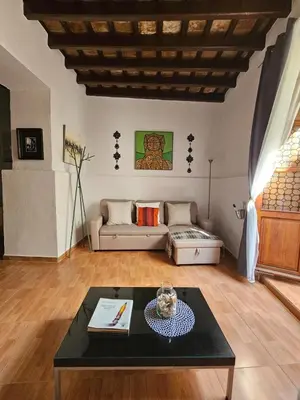 a living room with a couch and a table at Sherryflat Naranjas 9 in Jerez de la Frontera