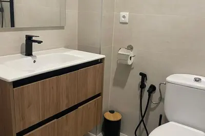 a bathroom with a sink and a toilet at Apartamento La Barrosa Beach in Novo Sancti Petri