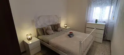 a bedroom with a white crib with a teddy bear on it at Vivir es Increíble in San Fernando
