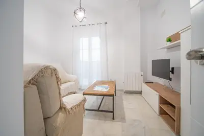 a living room with a couch and a table at Soto Urban Apartment in Cádiz