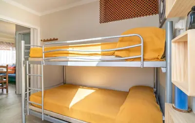a bunk bed room with two bunk beds in it at Nice Apartment In Chipiona With Wifi in Chipiona