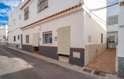 a white building on the side of a street at Nice Apartment In Chipiona With Wifi in Chipiona
