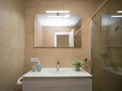 a bathroom with a sink and a mirror at SibsSanlucar Calma - Centro y Playa - Nuevo in Sanlúcar de Barrameda